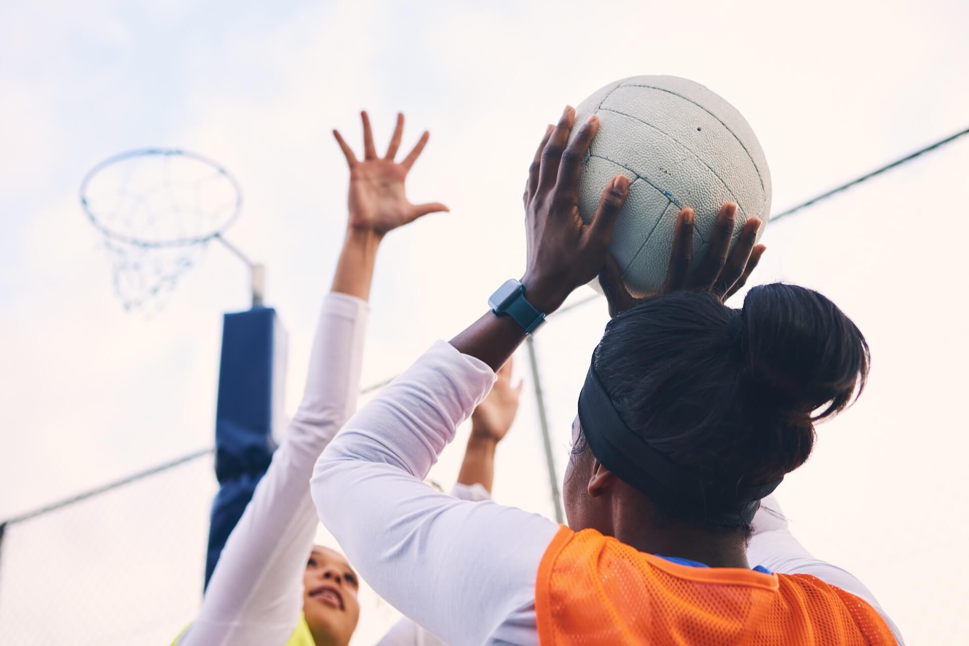 People playing netball | Featured image for the Netball Court Cleaning page from MKL Pressure Cleaning.